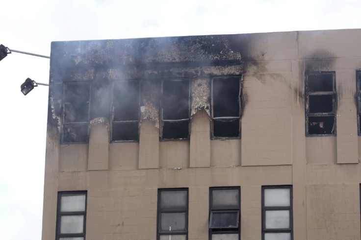 Smoke pours from the upper storey of the Loafers Lodge hostel in Wellington