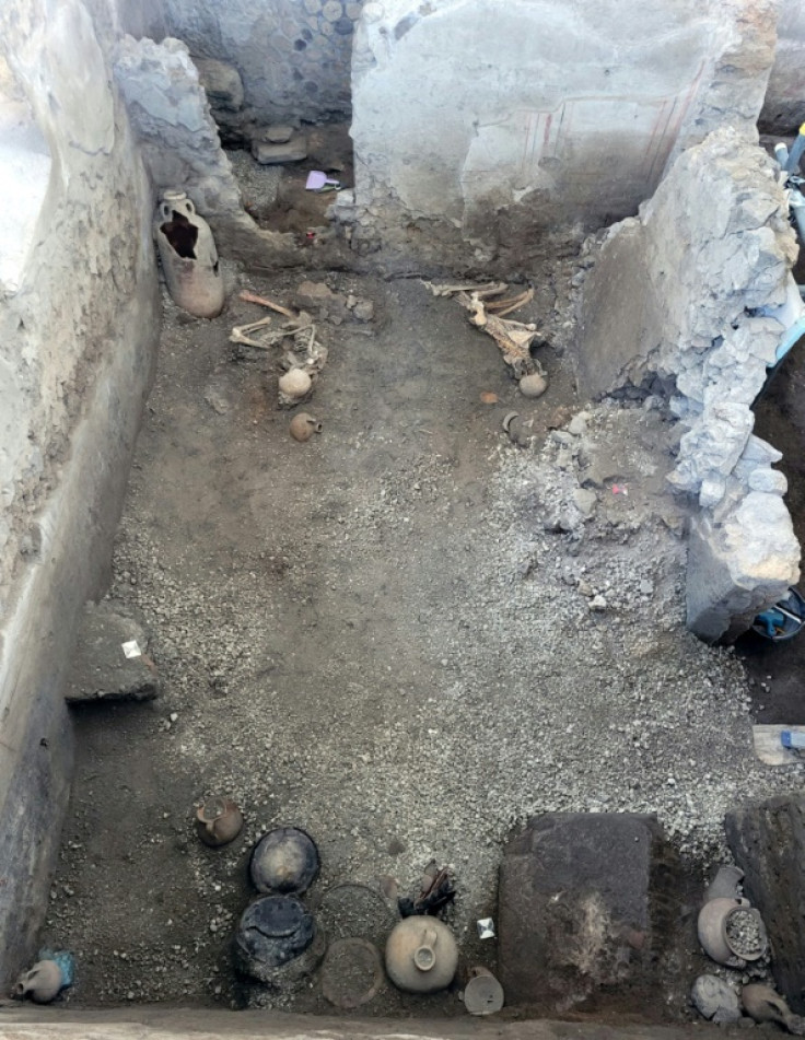 An amphora and a collection of jugs and vases were found inside the room with the victims