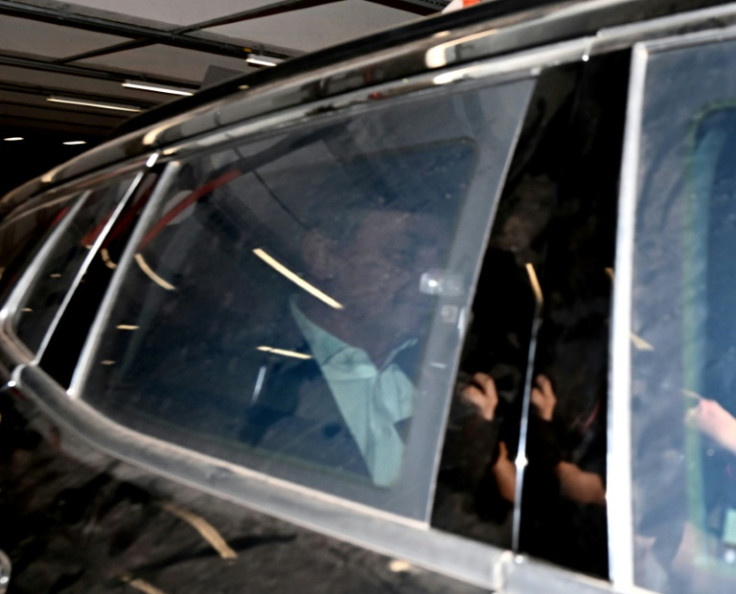 Former Brazilian president Jair Bolsonaro leaves the federal police headquarters in Brasilia after testifying in an investigation into an alleged scheme to forge Covid-19 vaccination certificates, on May 16, 2023