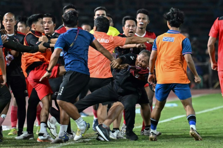 A fight breaks out on the sidelines of the men's final between Thailand and Indonesia
