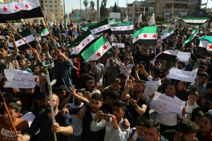 Syrians in the rebel-held northwestern city of Idlib protested the thaw in relations between Assad's government and several Arab countries