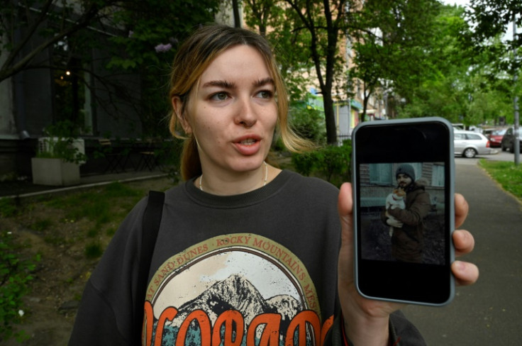 Yevgenia Synelnyk shows a picture of her brother who is held by Russia