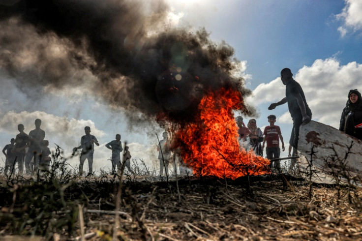 Palestinians in Gaza held a rival flag march along the border with Israel