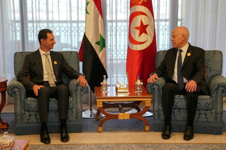 Syrian President Bashar al-Assad (L) meeting with his Tunisian counterpart Kais Saied on the sidelines of the Arab League Summit in Jeddah