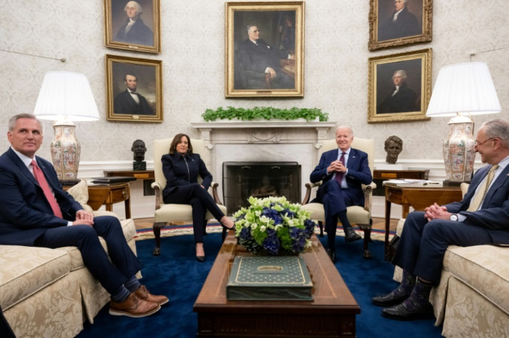 US President Joe Biden (2R) speaks during a meeting on the debt limit with (L-R) US House Speaker Kevin McCarthy (R-CA), US Vice President Kamala Harris, and Senate Majority Leader Chuck Schumer (D-NY) in the Oval Office of the White House in Washington, 