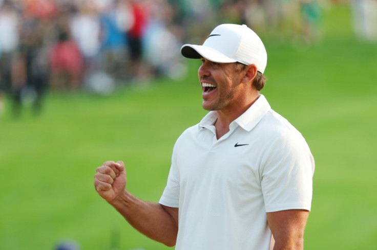 American Brooks Koepka celebrates on the 18th green after winning his fifth major title by capturing the PGA Championship at Oak Hill