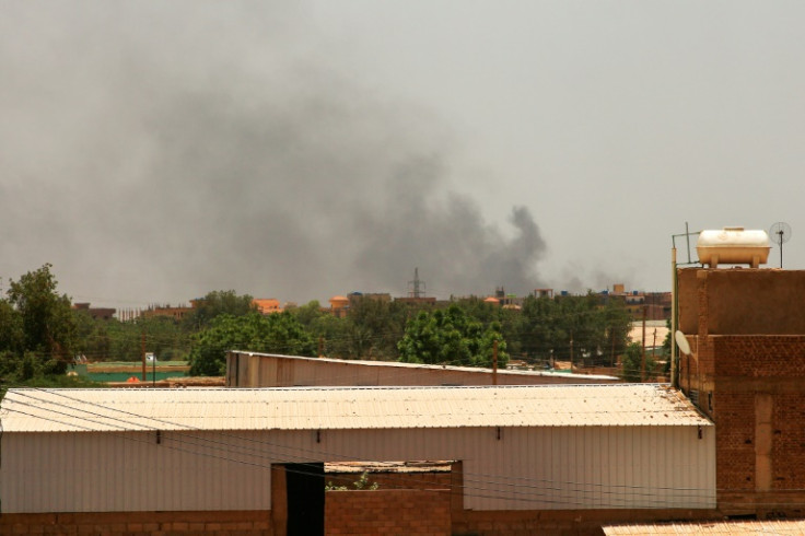 Smoke billows in the distance in Khartoum, hours before a ceasefire is to take effect between Sudan's army and paramilitaries