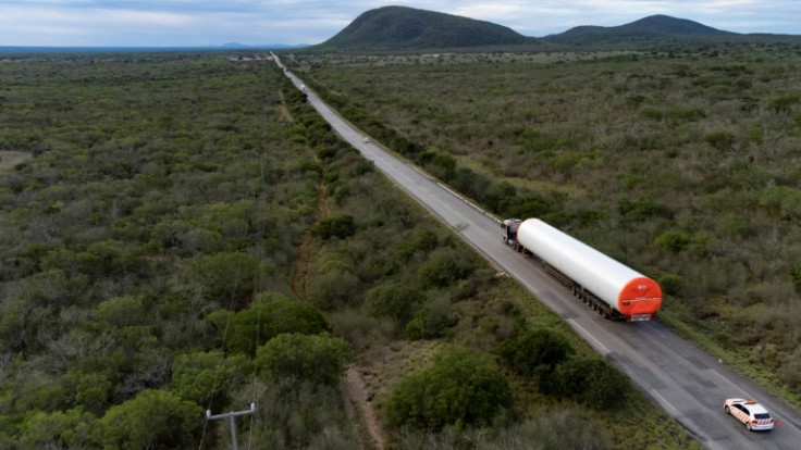 A truck transports parts of a wind turbine on the way to the Canudos Wind Energy Complex in Canudos, Bahia state, Brazil, on May 6, 2023
