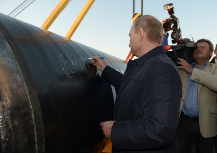 Russian President Vladimir Putin signing in 2014 the first segment of Power of Siberia pipeline that now transports Russian natural gas to China