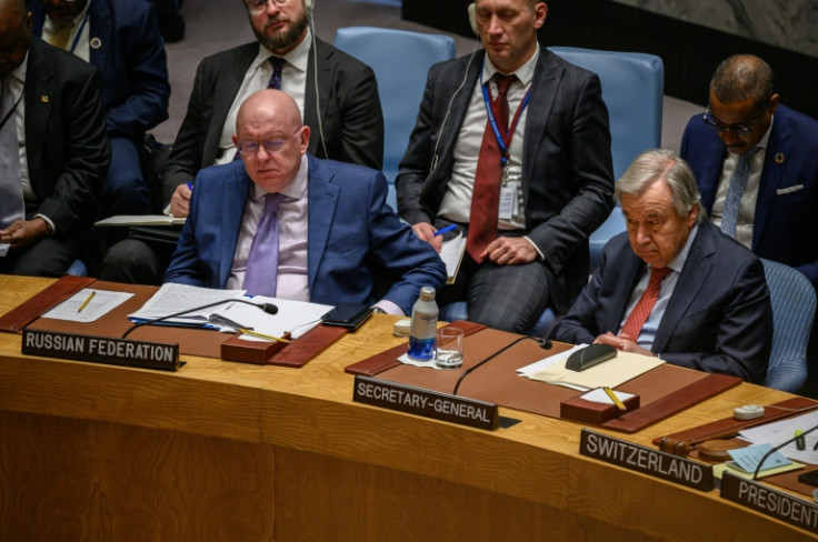 Russian ambassador Vasily Nebenzya sits next to UN Secretary-General Antonio Guterres at a Security Council meeting on May 23, 2023