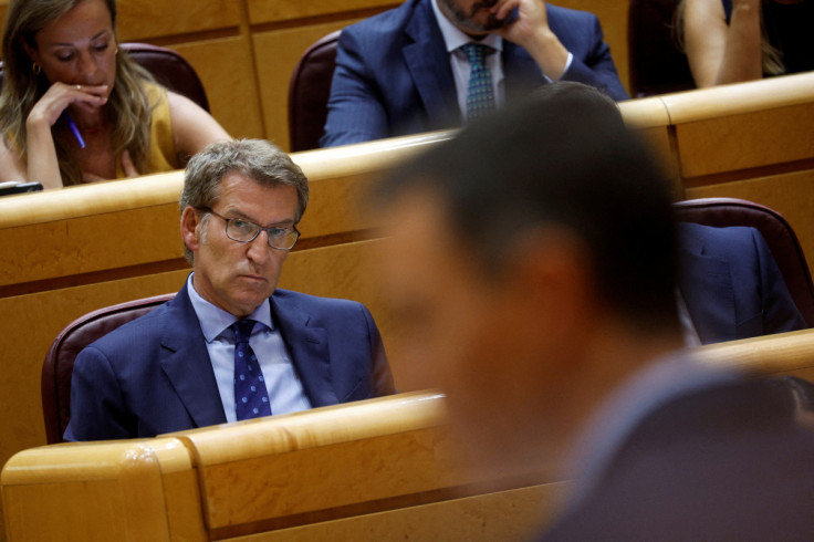 Spain's opposition People's Party (PP) leader Feijoo listens to Spain's PM Sanchez speak during a session at the Spanish Senate in Madrid