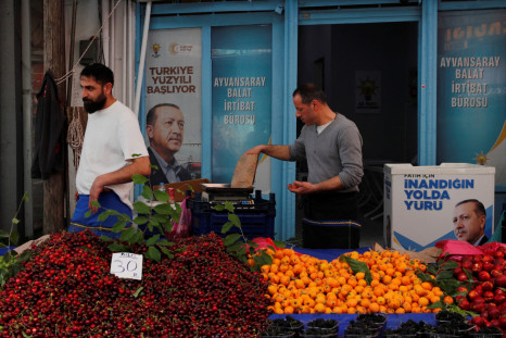 Vendors stand in their stall at a fresh market in Istanbul