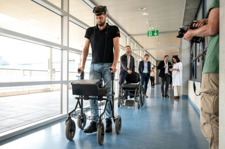 Gert-Jan, who is paralysed, walks using new technology that decodes his brain's signals