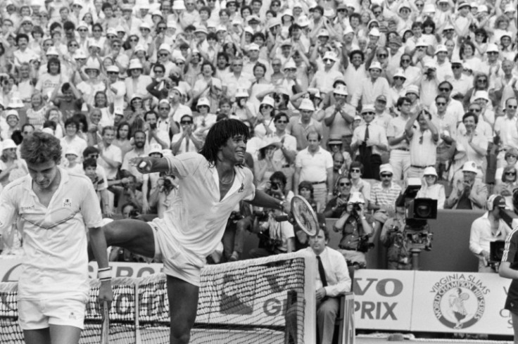 Last man standing: Yannick Noah cries with joy and steps over the net after winning the 1983 French Open