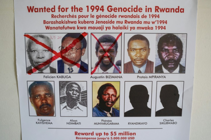 Fulgence Kayishema, bottom left, pictured in May 2020 on a wanted poster at the Genocide Fugitive Tracking Unit office in Kigali, Rwanda