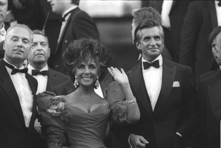 Elizabeth Taylor and George Hamilton arrive at the 40th Anniversary ceremony of the Cannes film festival