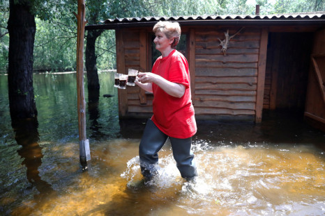 Medunova walks on a flooded island which locals and officials say is caused by Russia's chaotic control of the Kakhovka dam downstream, near Zaporizhzhia