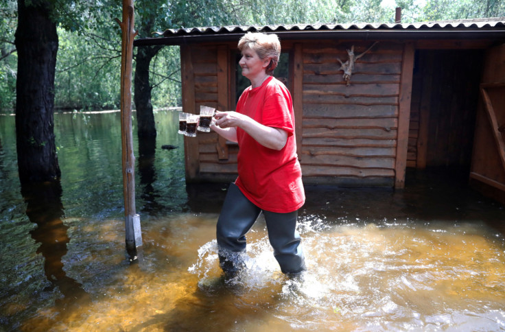 Medunova walks on a flooded island which locals and officials say is caused by Russia's chaotic control of the Kakhovka dam downstream, near Zaporizhzhia