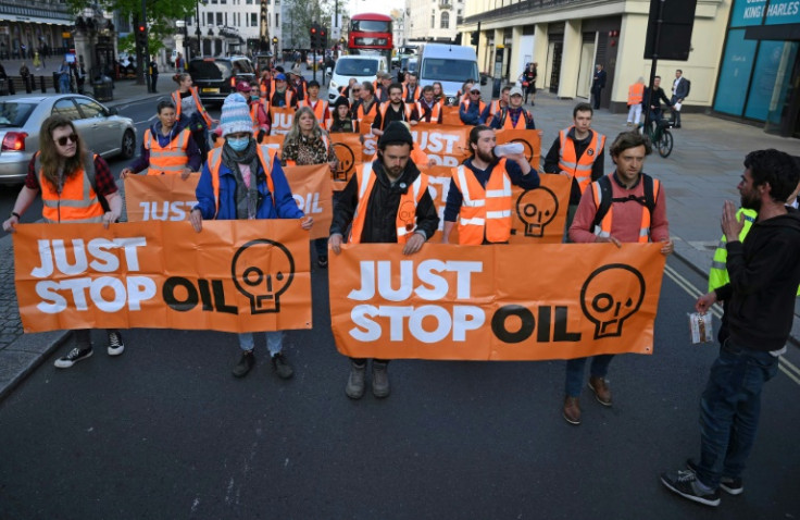 Just Stop Oil protesters threw orange paint on an exhibit at the Chelsea Flower Show