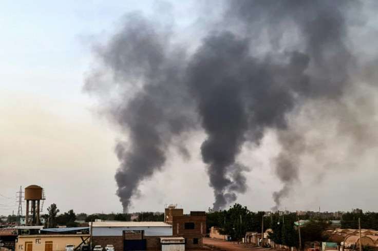 Smoke rises above buildings in Khartoum on May 24