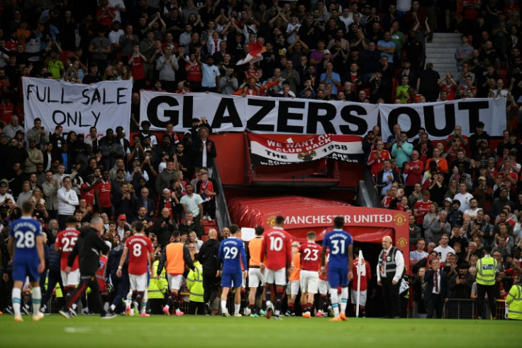 Manchester United fans displayed "Glazers out" banners as they secured a return to Champions League football next season