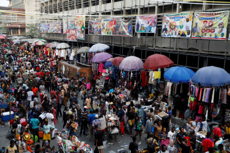 People crowd a market place as they shop in preparation for Christmas in Lagos