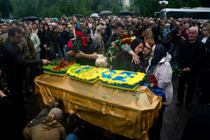 Relatives and friends gather at the funeral of a Ukrainian soldier who died in the eastern Donetsk region