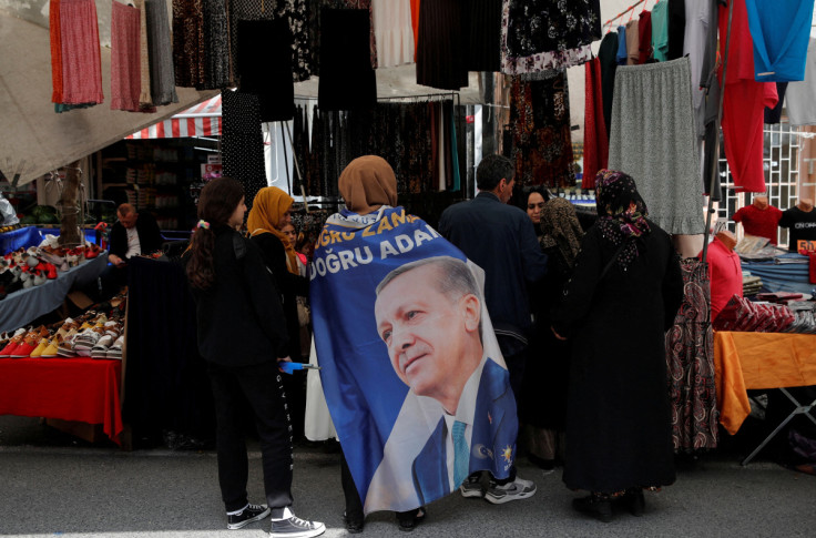 People shop at a market in Istanbul