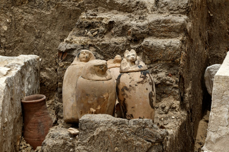 Clay pots and ritual vessels placed near the stony beds used for mummification