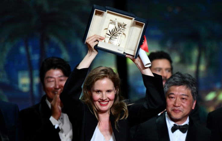 Justine Triet celebrates winning the top prize at Cannes, the Palme d'Or, in 2023