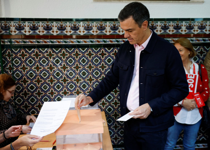 Spain's Prime Minister Pedro Sanchez casts his vote at a polling station during Regional elections, in Madrid