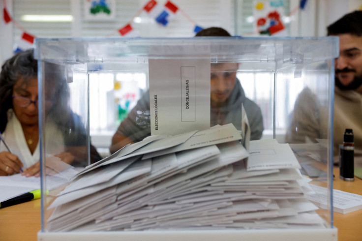 Members of an electoral table prepare to count the ballots of the local elections, in Ronda