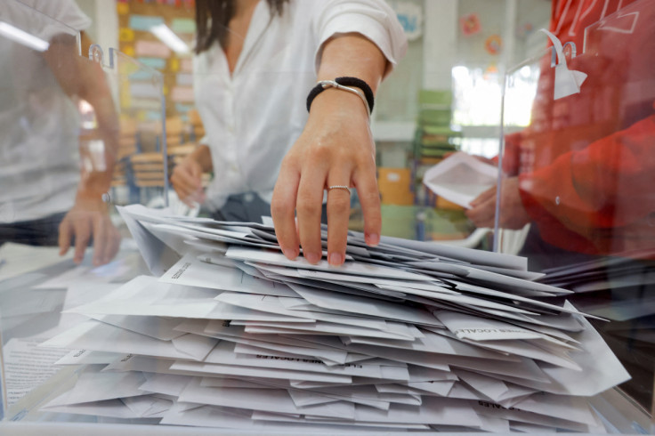 Members of an electoral table count the ballots of the local elections, in Ronda