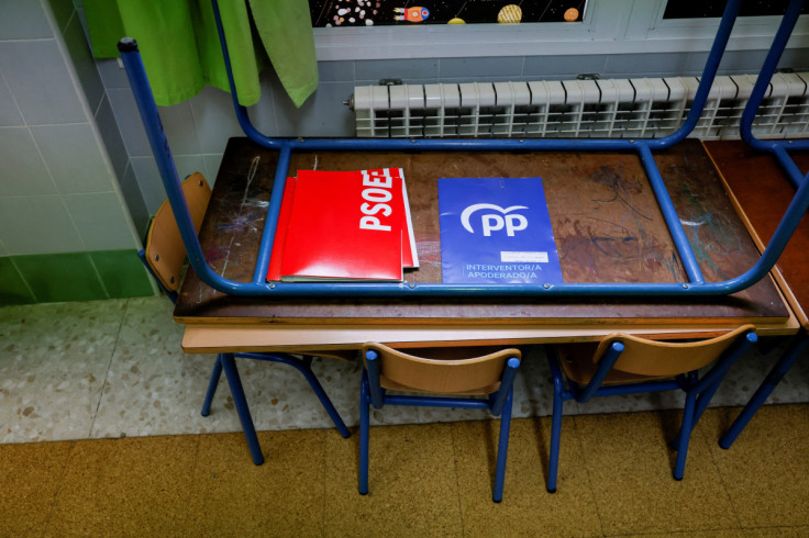 Folders of PSOE and PP are seen on a table at a polling station during the local elections, in Ronda