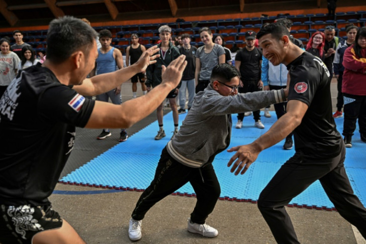 The attendees were shown how best to block an attack and where to hit back: aiming with the elbow or knee at an aggressor's neck, ribs, genitals and thighs