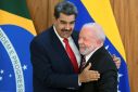 Venezuela's President Nicolas Maduro (L) and Brazil's President Luiz Inacio Lula da Silva (R) greet each other after a joint press conference at the Planalto Palace in Brasilia on May 29, 2023