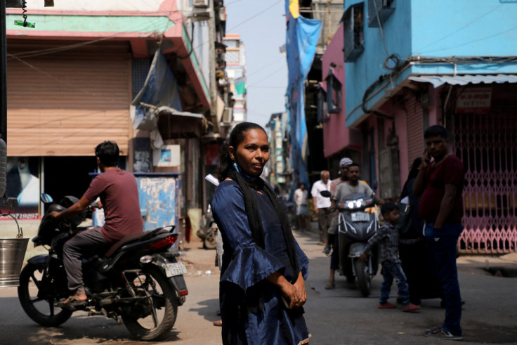 Naseem Jaafar Ali Sheikh poses for a photograph at a slum area in Mumbai