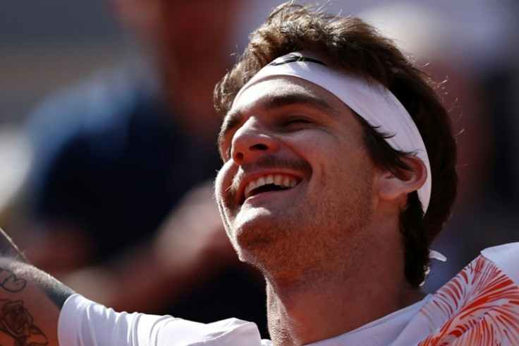 Smile of victory: Brazil's Thiago Seyboth Wild celebrates after defeating world number two Daniil Medvedev