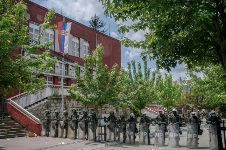 NATO soldiers and International military police secure the area near Zvecan after clashes with Serb protesters