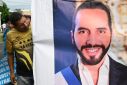 Pro-government union workers march to support the reelection of Salvadoran President Nayib Bukele, who is running for a legally controversial second term