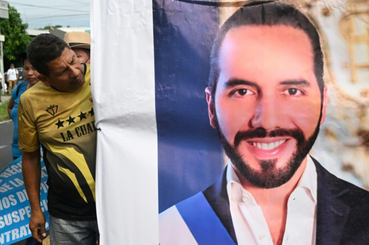 Pro-government union workers march to support the reelection of Salvadoran President Nayib Bukele, who is running for a legally controversial second term