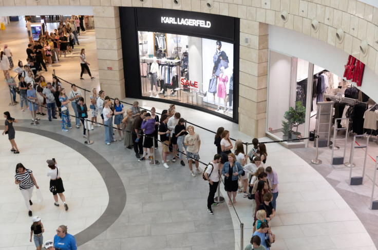 People line up to enter an H&M store in Moscow