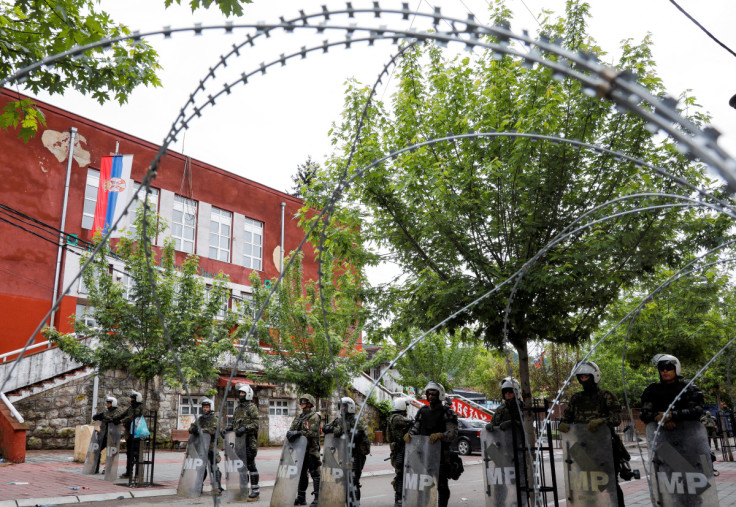 Polish members of the NATO-led Kosovo Force (KFOR) stand guard near a municipal office in Zvecan