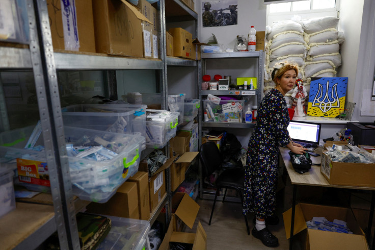 A volunteer prepares individual first aid kits for Ukrainian service members at the office of Prytula's charity foundation in Kyiv