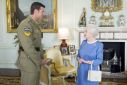 Britain's Queen Elizabeth II greets Australian SAS Corporal Ben Roberts-Smith, who was recently awarded the VC, during an audience at Buckingham Palace in London