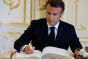 The write stuff: French President Emmanuel Macron signs the Golden Book at Slovakia's presidential palace Tuesday