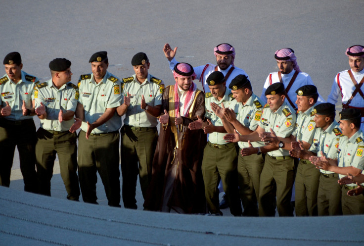 Jordan's Crown Prince Hussein celebrates with colleagues at the Royal Hashemite Court in Amman