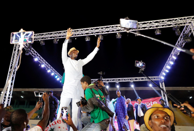 Presidential candidate Ousmane Sonko speaks during a campaign rally in Pikine