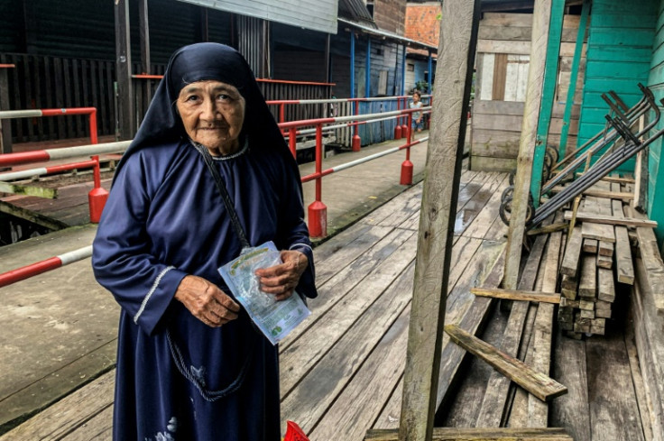 A nun walks in the village of Islandia in the Peruvian Amazon