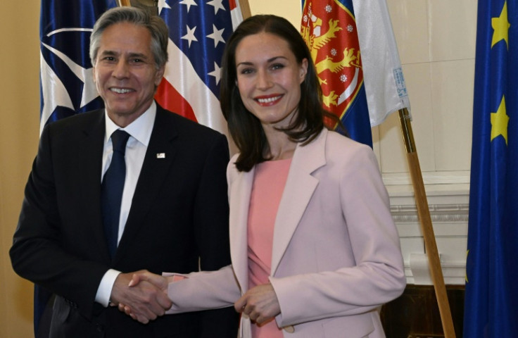 US Secretary of State Antony Blinken and Finnish Prime Minister Sanna Marin shake hands as they meet in Helsinki where he delivered a speech on the Ukraine war